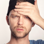 guy in backwards hat frustrated